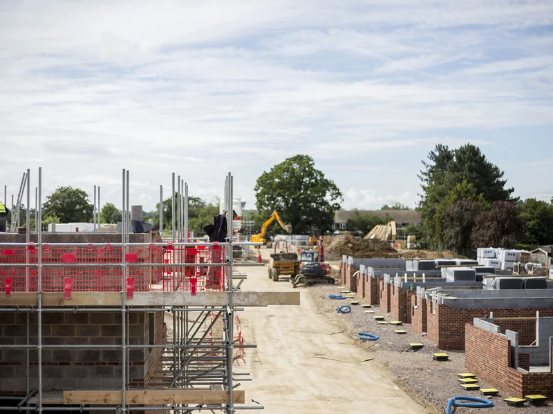Multi-plot housing development during roof construction at Moor Hall Road