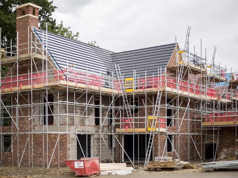 SolarTyle roof installation on a scaffolded UK housing development