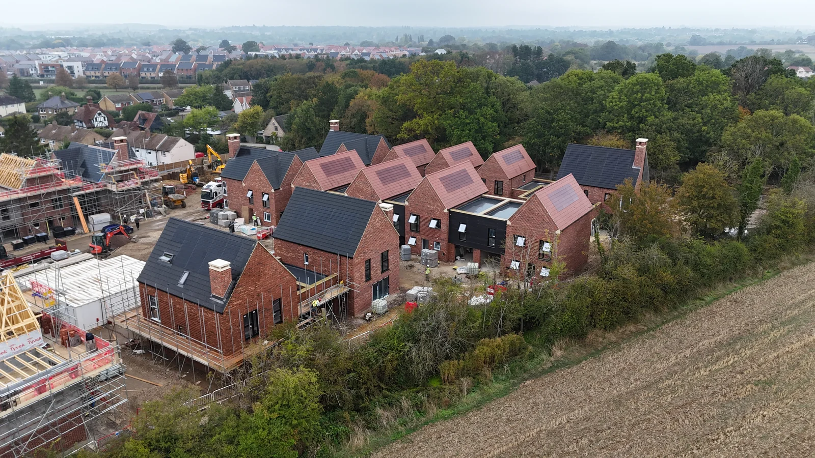 Red and anthracite SolarTyle roofs at the ongoing Moor Hall development
