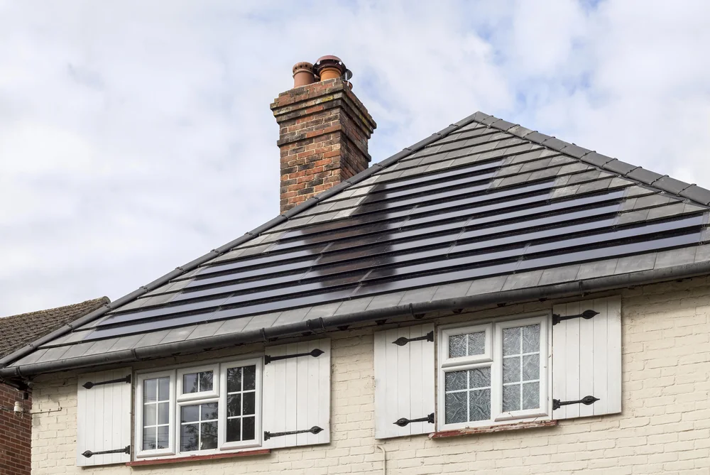 Close roof view showing the integrated tile finish above the cottage windows