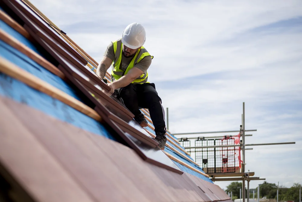 Roof installation work showing the SolarTyle module and batten arrangement