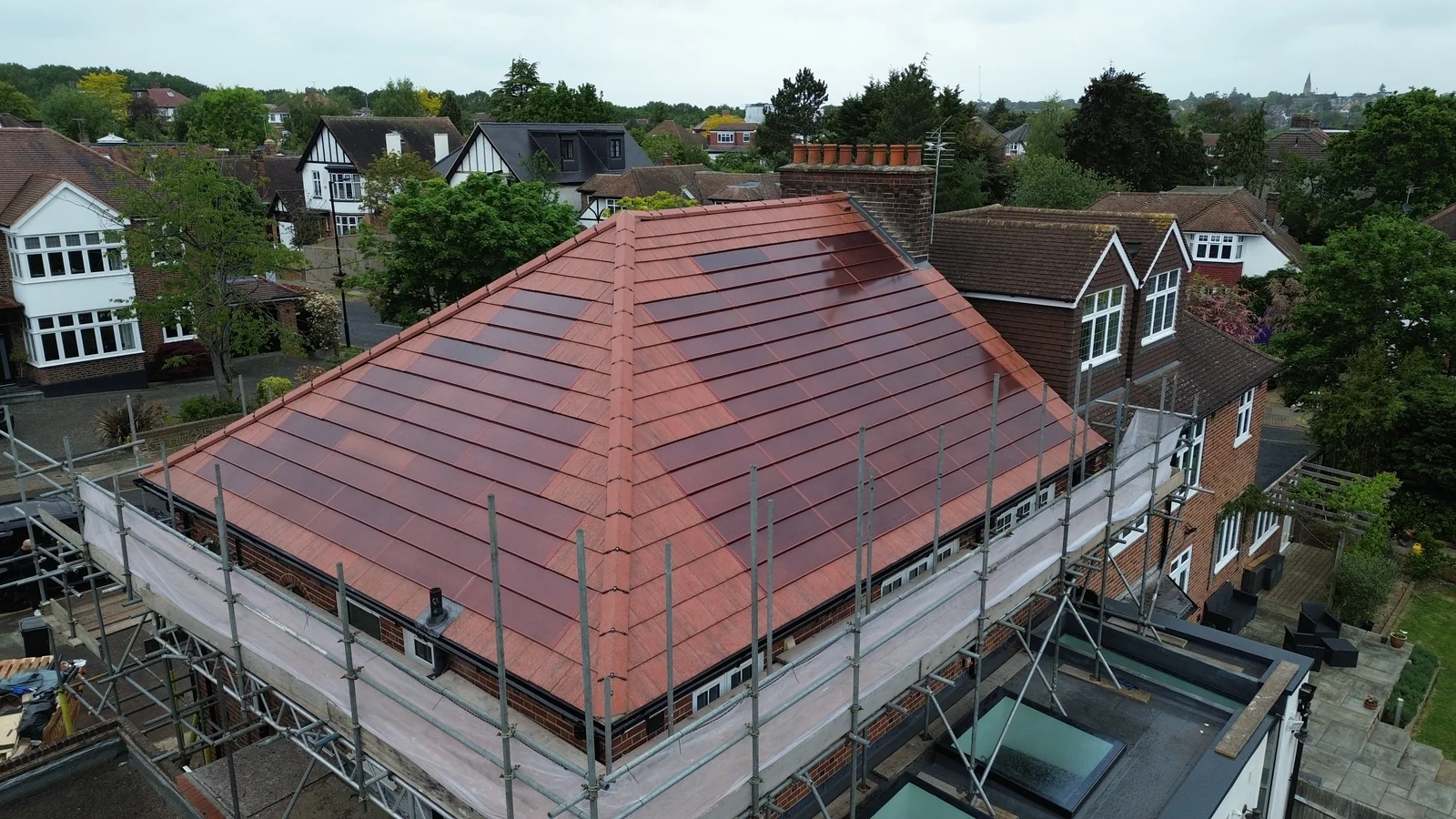 Red SolarTyle roof during installation at Bazile Road