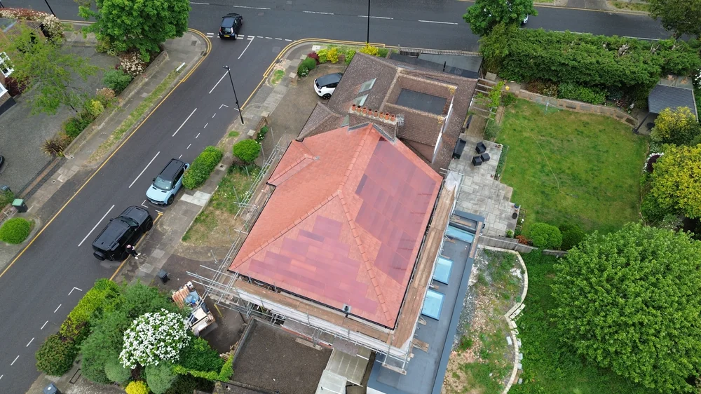 Overhead view of the red roof with scaffolding in place