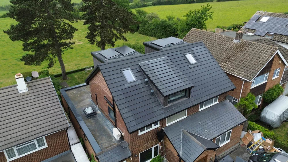 Integrated solar roof seen from the surrounding garden setting