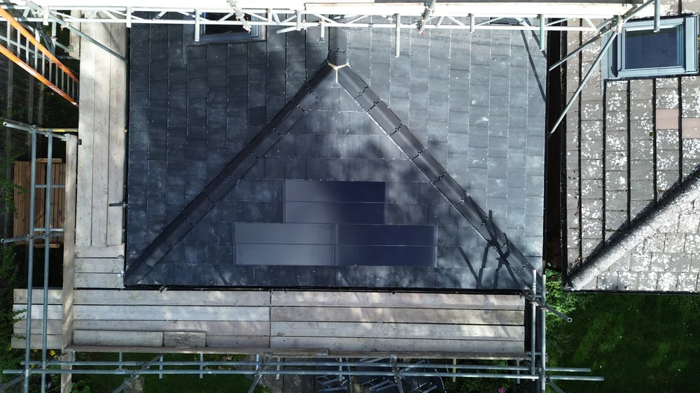 Overhead view of SolarTyle courses with scaffolding around the roof