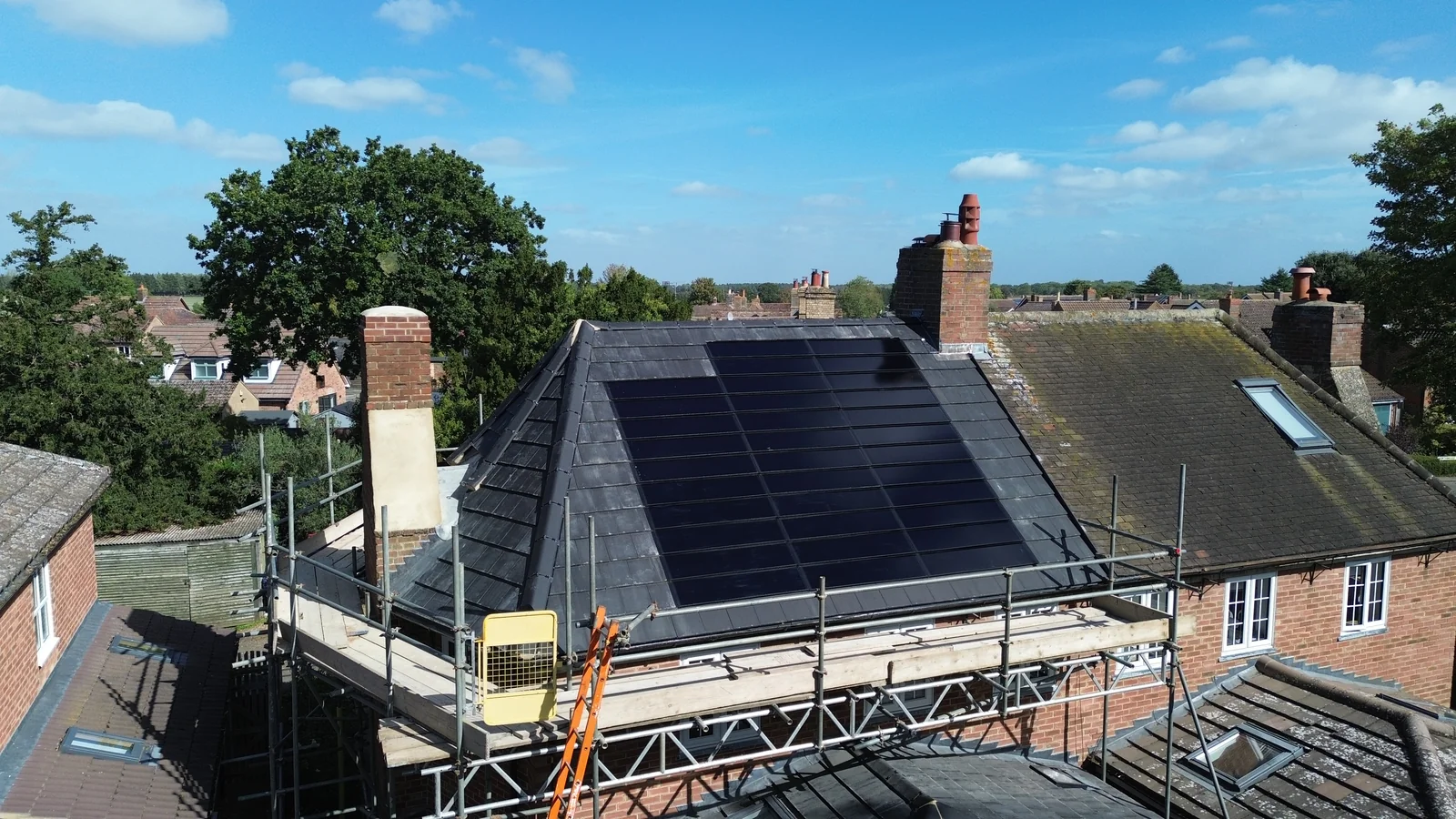 The Bedford property and its roof during installation