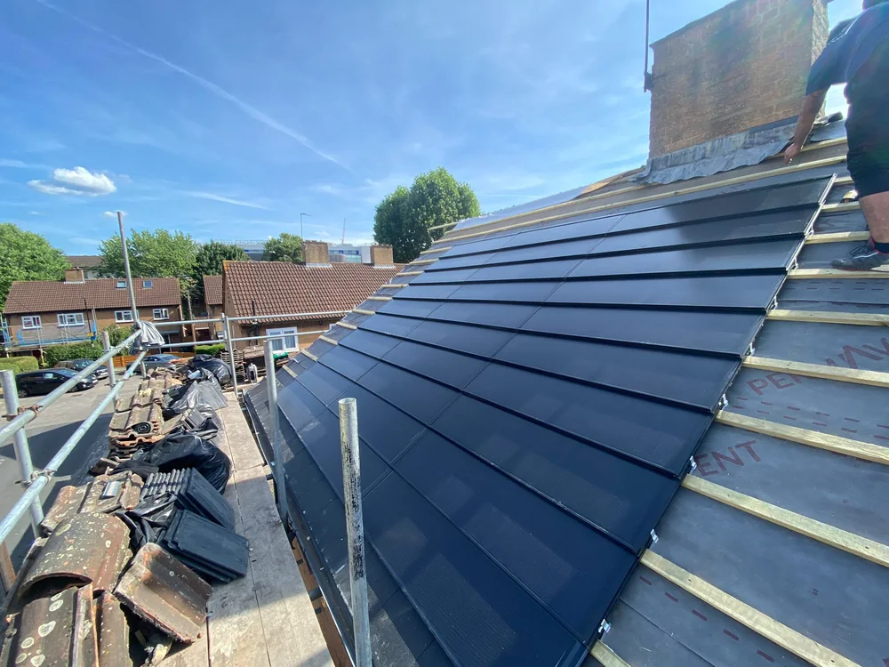SolarTyle courses being installed on the Bowerman Avenue roof